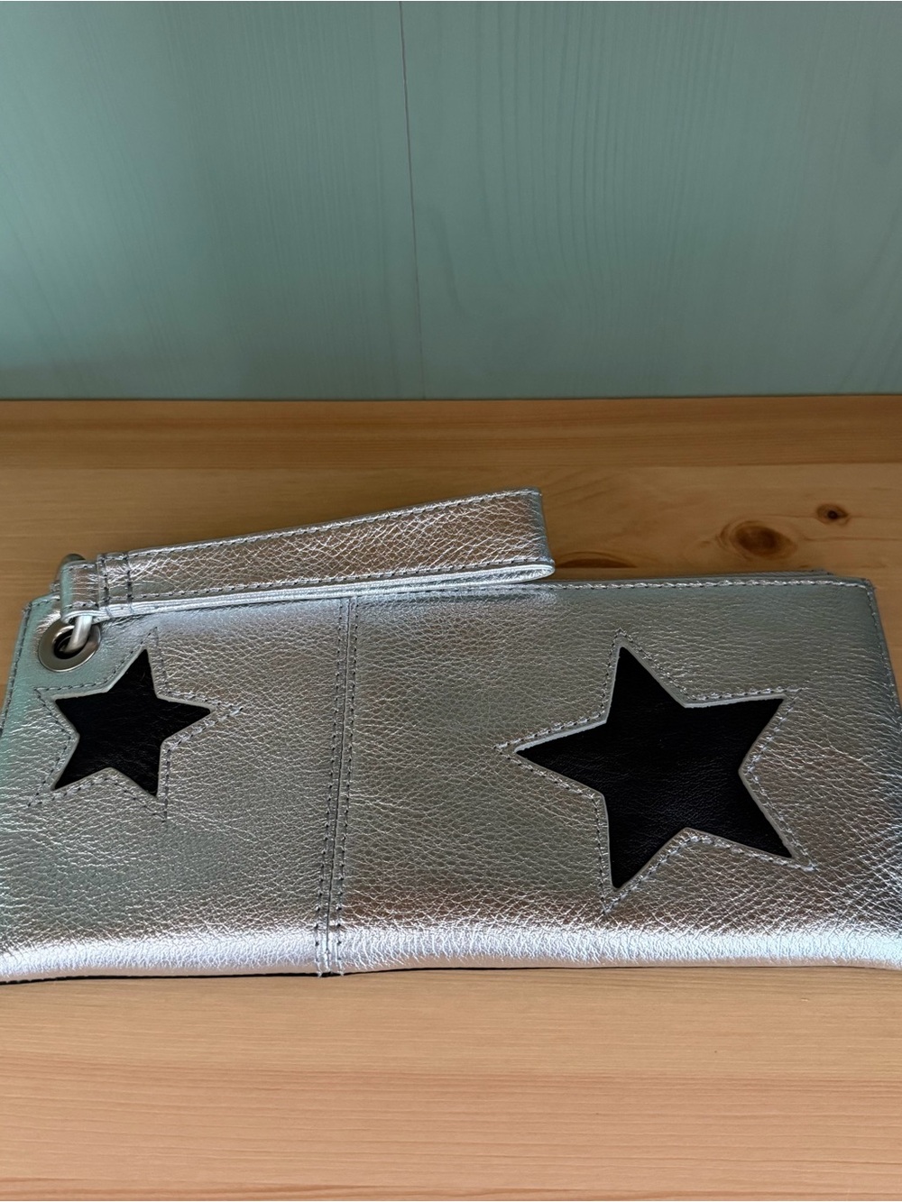 HOBO Vida wristlet in Argento black and silver leather stars
